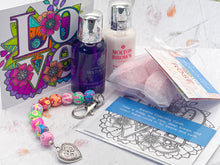 Load image into Gallery viewer, Floral Bead, Bag or Key Charm Gift pack with Heart Charm, for Valentines or Mothers day with Colouring in card, bath fizzes and other curated goodies
